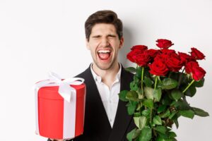 image-sad-guy-suit-got-rejected-crying-holding-bouquet-roses-present-standing-miserable-against-white-background-min